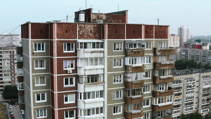 Wall Mural - Top view of old residential buildings in city in summer. Stock footage. Residential communal complexes in old district of city. Shabby old houses in residential area in summer