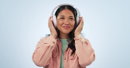 Sticker - Studio music, happy dance and Asian woman listening, streaming and enjoy radio podcast, kpop or relax media song. Audio headphones, wellness sound and Japanese dancer smile on blue background