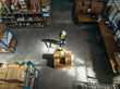 © Jacob Lund - Top view of a warehouse worker pushing a pallet jack