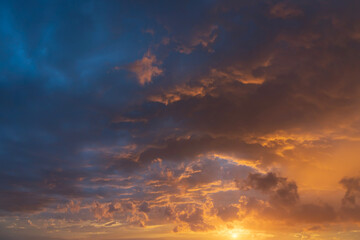 Wall Mural - glowing sky at sunset texture background overlay. dramatic red and orange clouds.