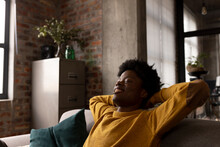 Happy African American Man Relaxing On Couch With Eyes Closed At Home, Copy Space