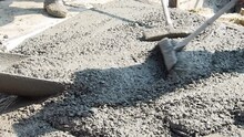 Pouring Concrete On Reinforced Concrete Roads Using A Ready-mix Cement Truck.