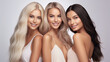 © AstraNova - Model Group of three beautiful smiling women with healthy blonde and black hair in bright photo studio background