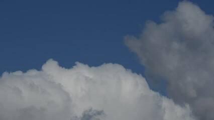 Wall Mural - movement of beautiful clouds in the blue sky, time lapse video. nice nature background for your proj