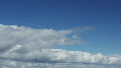 Wall Mural - movement of beautiful clouds in the blue sky, time lapse video. nice nature background for your proj
