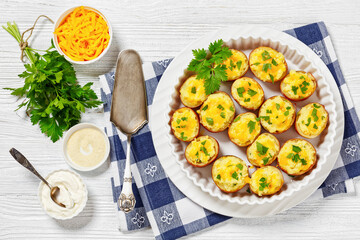 Sticker - baked stuffed red potato on white baking dish