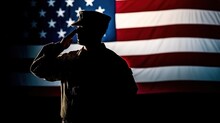 A Silhouette Of A Soldier Saluting The Flags