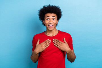 Wall Mural - Portrait of impressed positive man arms touch chest open mouth cant believe isolated on blue color background