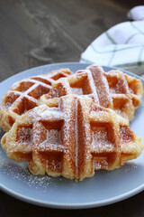 Canvas Print - Closeup of Mouthwatering Croffles Sprinkled with Powdered Sugar