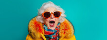 Colorful Studio Portrait Of Eccentric Elderly Granny Wearing Orange Fur And Sunglasses, Blue Background