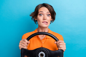 Poster - Photo of guilty unhappy lady wear orange t-shirt biting lip getting in car crash isolated blue color background