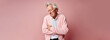 Old man holding stomach with discomfort from gastritis on pink background