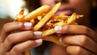 A close-up of person eating fries,close up on mouth.