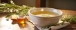 An artistic shot of bone broth in a vintageinspired ceramic bowl, showcasing the simplicity and timehonored tradition of this wholesome, soulsoothing culinary creation.