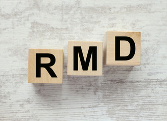 RMD .Required Minimum Distribution. Abbreviation for wooden cubes . Business concept