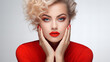Beautiful girl showing red manicure nails and red lips. Woman Makeup, beauty and cosmetics concept. Copy space