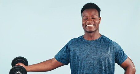 Canvas Print - Fitness, black man and dumbbell in studio for training, exercise or workout with happiness on blue background. Weightlifting, person and bodybuilder for wellness and healthy body with smile at gym