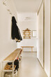© ADDICTIVE STOCK - Contemporary home with hallway and wooden shoe rack