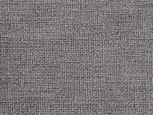 Gray Woven Surface Close-up. Linen Textile Grey Texture. Fabric Net Black And White Background. Textured Braided Len Wallpaper. Macro