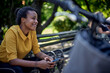 © kerkezz - a girl with a smile is resting in the park after a bicycle ride