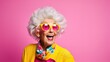 © Svetlana - Funny stylish elderly grandmother in glasses poses at studio. Senior old woman looking at camera over bright background.