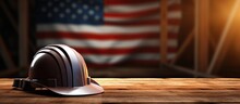 A A Helmet On A Wooden Table With American Flag Background Celebrating Labor Day