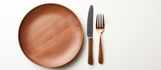 Balanced food with various products seen from above next to cutlery on white background