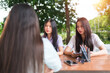 © EduLife Photos - Asian university students meet their education advisor to discuss their academic project outdoor in campus