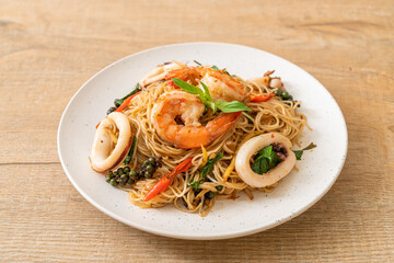 Wall Mural - stir-fried Chinese noodle with basil, chilli, shrimps and squid