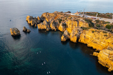 Wall Mural - Ponta da Piedade, Algarve, Portugal. Natural beach and cliffs. Aerial drone view