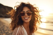 Portrait Of Beautiful Happy Woman Wearing Sunglasses On The Beach At Sunset