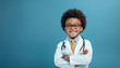 little boy is smiling while dressed in a doctor