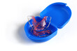 Acrylic dental retainer in box on white background, Healthy teeth and tooth hygiene concept