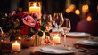 Elegant table setting with candles and flowers in restaurant. Selective focus. Romantic dinner setting with candles and flowers on table in restaurant