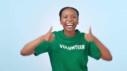 Poster - Thumbs up, volunteer and woman for charity, eco friendly support and nonprofit goals on a blue background. Excited face of african person with success, hands or like emoji and dance for NGO in studio