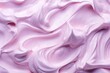 Pink homemade yogurt with a creamy texture featuring blueberries or strawberries in a close up macro shot