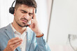 Leinwandbild Motiv Call center stress, anxiety or man with headache pain from burnout fatigue in a telecom company job. Migraine, failure crisis or tired consultant depressed or frustrated by crm or sales job deadline