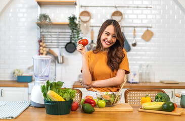 Wall Mural - Portrait of beauty body slim healthy asian woman having fun cooking and preparing cooking vegan food healthy eat with fresh vegetable salad on counter in kitchen at home.Diet concept.Fitness, healthy 