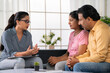Indian psychologist advising to middle aged couple during counseling at home consultation - concept of therapy session, Emotional Guidance and Mental Health.