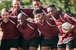 © Talia Mdlungu/peopleimages.com - Portrait, men and rugby with smile while standing, together and happiness for victory. Team, young and boys for sports for bonding with exercise, fitness or winning of game, tournament or practice
