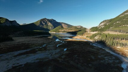 Wall Mural - drone view of a forest, rivers and mountains in the rocky mountains. landscape from the air. video f