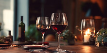A Glass Of Red Wine On A Table In A Restaurant. Selective Focus. Wineglass With Red Wine And Grapes On The Wooden Table.
