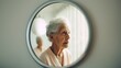 Elderly woman with Alzheimer, reflection in mirror 