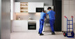 © Andrey Popov - Electrician Technician Working To Repair Refrigerator