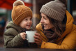 Picture of a mom with kid and her hot chocolate outside in the fall, happy thanksgiving image