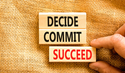Wall Mural - Decide commit succeed symbol. Concept word Decide Commit Succeed on beautiful wooden block. Businessman hand. Beautiful canvas table background. Business decide commit succeed concept. Copy space.