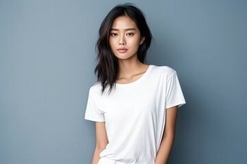 Wall Mural - Blank white t-shirt, beautiful asian woman model wearing t-shirt