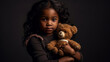 © JKLoma - little african american girl hug her doll and cry or scare or sad or feel bad.