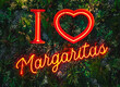 A red neon sign saying I Love Margaritas