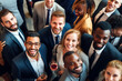 group of people in business attire smiling in a big crowd.  group of business people that are smiling looking up to camera. team of business people and customers in a room with drink